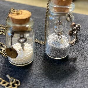 Vintage Charm Bottle Necklaces for only $15.00 for both of them.